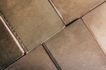 Photo of old antique leather cover books laying on surface, upper view pattern.