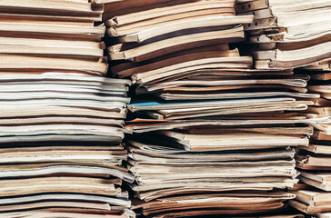 Photo of old antique magazines stack pattern. Paper recycling concept.