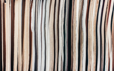Photo of old antique magazines row pattern. Paper recycling concept.