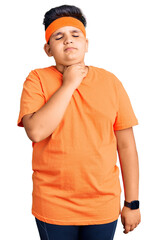 Little boy kid wearing sportswear touching painful neck, sore throat for flu, clod and infection