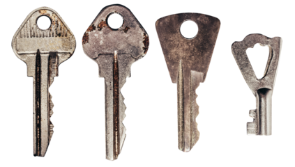 Isolated photo of old fashioned rusty keys set on white background.