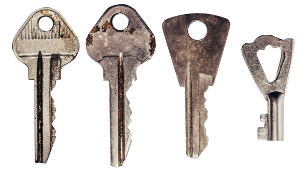 Isolated photo of old fashioned rusty keys set on white background.