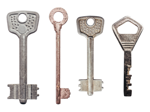 Isolated photo of old fashioned rusty keys set on white background.