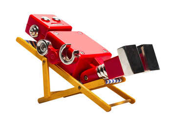 Isolated photo of red toy robot laying on deckchair on white background.