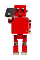 Isolated photo of red toy robot holding sd card on white background.