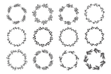 Set of isolated delicate sketch botanical round wreaths with leaves and branches. Set of black color doodle spring floral frames for greeting card design, wedding decoration
