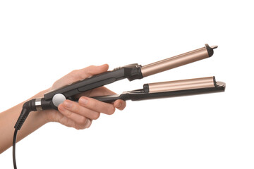 Woman holding modern triple curling iron on white background, closeup