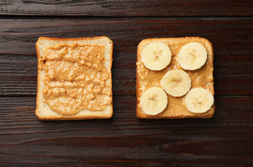 Delicious toasts with peanut butter and banana on dark wooden table, flat lay