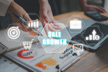 Sale growth concept, Business team analyzing income charts and graphs on business paper with sale...