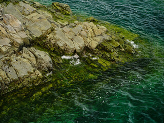 Beautiful green crystal clear waters surrounding the Puffin breeding grounds on Fogo Island in Newfoundland-Labrador