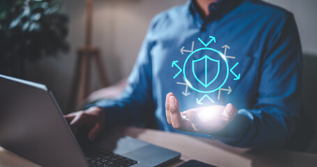 Naklejka premium technology, digital, security, artificial, innovation, intelligence, shield, learning, machine, reflect. close up of businessman and hand holding shield hologram with arrow. to means secure, safety