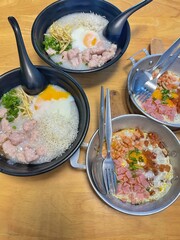 Panned eggs is fried egg topping with bacon and sausage,in the pan. Served with hot pan, famous in north eastern Thailand and Vietnam