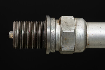 A generic spark plug for an aircraft engine. Small reciprocating airplane engines use massive...