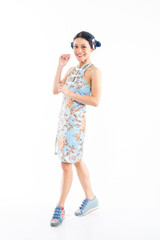 Portrait of an attractive Asian Chinese female wearing cheongsam or qipao isolated on white background for Chinese New Year concept