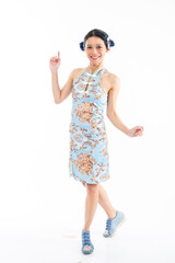 Portrait of an attractive Asian Chinese female wearing cheongsam or qipao isolated on white background for Chinese New Year concept