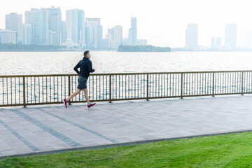 A man running in the city at morning. Healthy lifestyle.