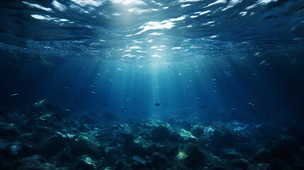Fototapeta na wymiar beautiful dark blur ocean surface seen from underwater with sunlight