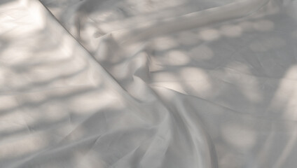 Curtain white wave and soft shadow of palm leaves. abstract background on isolated with shade leaf...