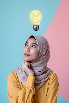 A thinking malay woman with a lightbulb on her head