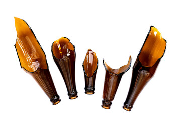 Broken brown bottle on white background