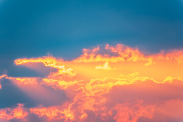 Dramatic cloudy sky background. Orange cloudy sunset sky.