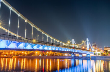 Fototapeta na wymiar Krymsky Bridge or Crimean Bridge in Moscow at summer night
