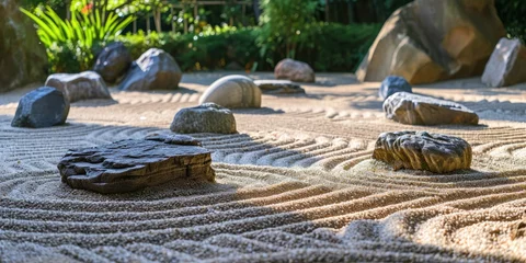 Fotobehang A peaceful Zen garden with raked sand and smooth stones © DailyStock