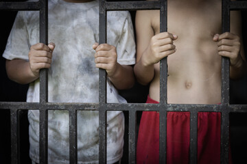 Children who were imprisoned in a room with a steel cage. The concept of stopping violence against...
