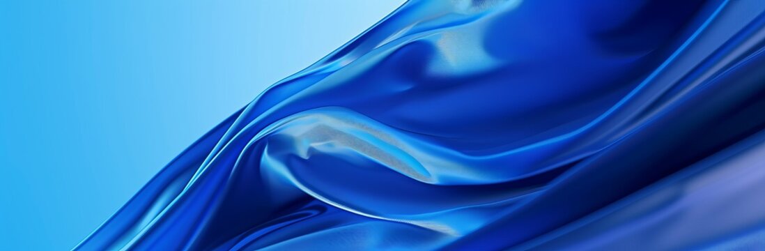 Elegant blue satin fabric background, perfect for luxury and fashion design themes.

