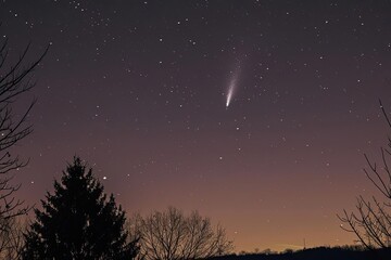 Comet streaking across the night sky Long tail visible