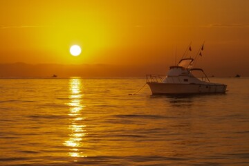Fototapeta na wymiar Small fishing boat at sunrise in Baja Mexico