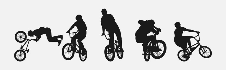 Set of silhouettes of BMX cyclist. Isolated on white background. Graphic vector illustration.