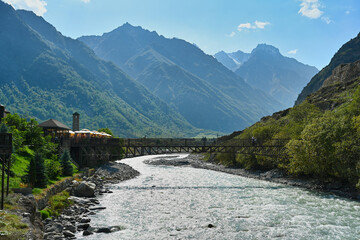 Suspension bridge over the Terek River in the village of Upper Balkaria, Kabardino-Balkaria Republic of Russia © pdeminhiker