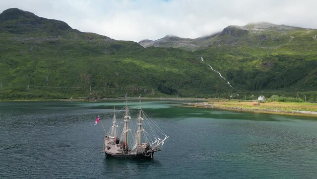 Pirate Ship and Dramatic Nature Landscape in Lofoten Islands, Norway - Aerial 4k Circling