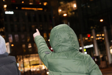 A person points to the city