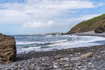 The cliffs and beach in Millook Haven, Cornwall, England, UK
