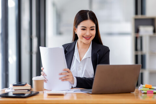 Business Documents, Auditor businesswoman checking searching document legal prepare paperwork or report for analysis TAX time,accountant Documents data contract partner deal in workplace office	