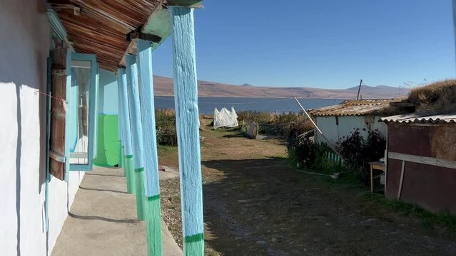 4k static shot captures Georgian countryside and rural life, Samtskhe-Javakheti region, near Paravani Lake. The area is known as Georgian Arctic and has a distinguished architecture.
