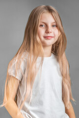 Fototapeta premium Portrait of cute little girl with long light hair