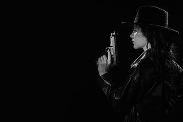 Silhouette of a female detective in a coat and hat with a gun in her hands. A book drama noir portrait in the style of detectives of the 1950s. - obrazy, fototapety, plakaty