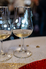 Small tasting glasses of sparkling wine champagne on winter festival in December, Avenue de Champagne, Epernay, Champagne region, France