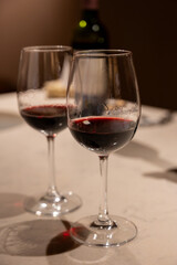 Tasting of red dry Saint-Emilion wine aged in French oak wooden barrels in cellar, Saint-Emilion wine making region, France, Bordeaux