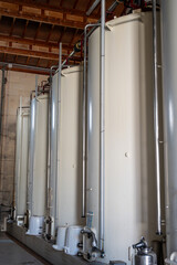 Steel tanks for first fermentation of grapes, Saint-Emilion wine making region picking, sorting...