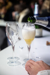 Visitors drink of sparkling wine champagne on outdoor winter festival in December on Avenue de Champagne, Epernay, Champagne region, France
