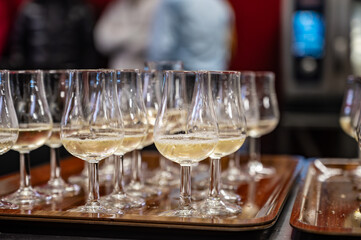 Many small tasting glasses of sparkling wine champagne on winter festival in December, Avenue de Champagne, Epernay, Champagne region, France