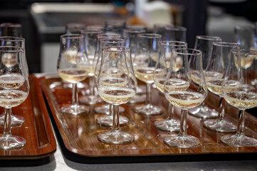 Many small tasting glasses of sparkling wine champagne on winter festival in December, Avenue de Champagne, Epernay, Champagne region, France