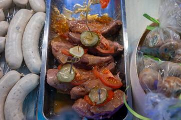 Assortment of meat on weekly food market in France, cow's tongue in jelly