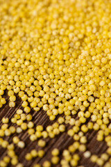 Background of raw millet seeds close up. Millet seeds texture.