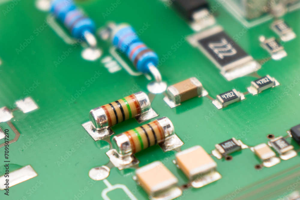 Poster circuit board with resistors microchips and electronic components background. computer hardware tech