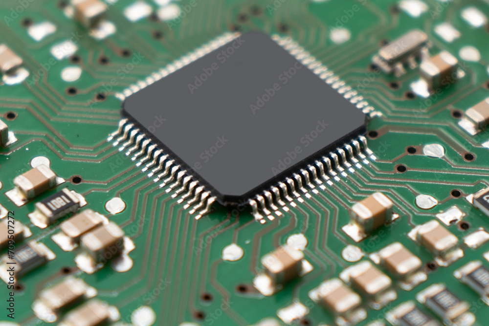 Poster circuit board with resistors microchips and electronic components background. computer hardware tech